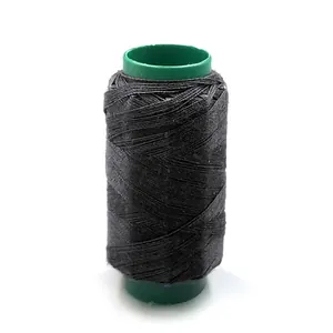 Black sewing thread spool for home DIY tailoring and clothes repair crafting projects