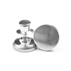 Silver magnetic curtain button close-up detail, strong magnetic clasp for home use decor.