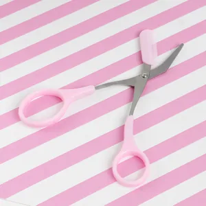 Pink eyebrow scissors with built-in comb for precise trimming and shaping makeup tools.
