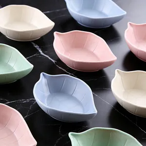 Colorful leaf-shaped wheat straw small sauce dishes, perfect for kitchen seasoning and soy sauce.