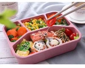 Wheat straw bento box four-compartment lunch container detailed food display view.