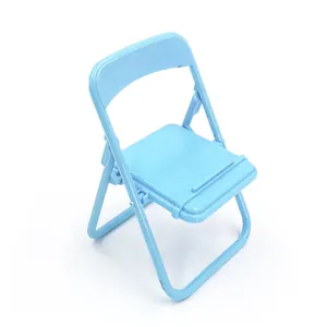 Close-up detail of the mini folding chair phone stand in cute light blue macaron color.