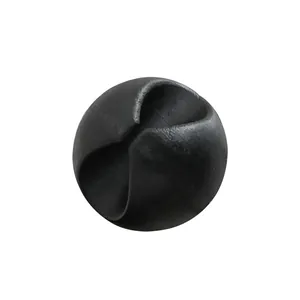 Black round silicone cable clip and cord organizer for tidy office desktop management.