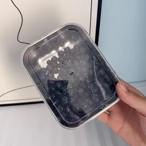 Stainless steel food storage container detail, clear lid design for fresh fruit and meals.