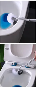 Toilet brush detail view showing flexible S-shaped handle and curved bristle head cleaning rim.