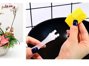 Silicone pastry brush with detachable yellow head and clear handle for baking and BBQ use.
