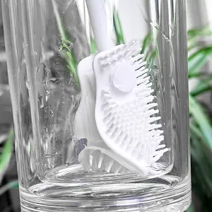 Silicone bottle brush with long handle and soft bristles for cleaning cups and bottles.