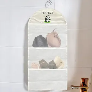 Hanging storage bag with transparent mesh pockets for organizing underwear and socks daily.
