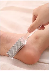 Close-up detail showing the double-sided metal foot file removing dead skin on heel efficiently.