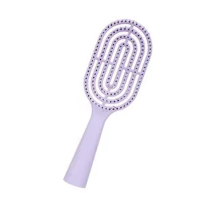 Detailed close-up view of the purple curved vented hair brush featuring flexible massage bristles.