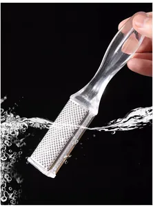 Close-up detail of double-sided foot file callus remover with clear handle for dead skin.