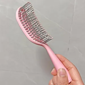 Curved pink hair brush vent styling massage comb for smooth hair and volume daily care salon.