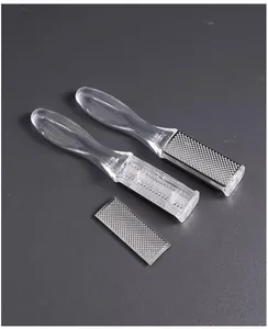 Close-up of double-sided foot file with clear plastic handle and stainless steel plate.