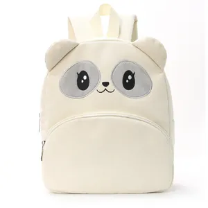 Cute white corduroy backpack for students, casual cartoon bear design with large capacity.