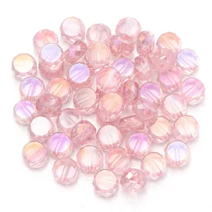 Pink faceted flat round crystal glass beads detail shot for DIY jewelry making accessories.