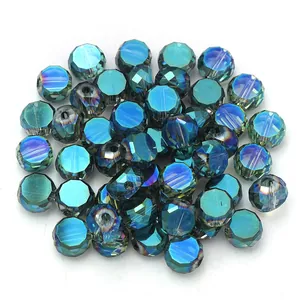 Close-up detail of faceted blue crystal glass flat round spacer beads for DIY jewelry making.
