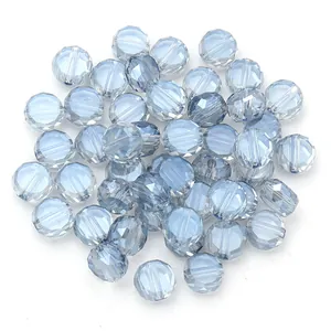 Close-up detail of light blue faceted crystal glass beads, perfect for DIY jewelry making.