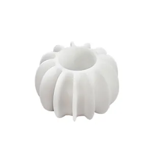 Anti-tangle washing ball detail view showing the white hollow ribbed structure design clearly.