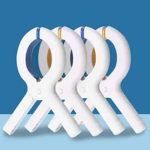 Grandes pinces à couette en plastique blanc pinces à linge coupe-vent vue détaillée
