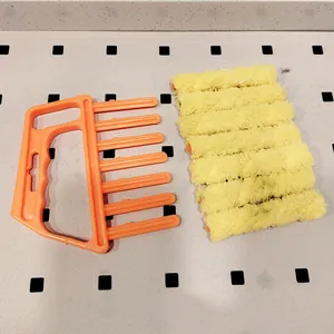 Replacement yellow fluffy roller blinds cleaning brush with orange plastic handle for air conditioner.