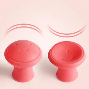 Silicone face massager detail showing flexible mushroom shape and cute smile expression.