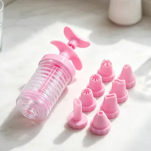 Plastic cookie press gun set with eight interchangeable piping nozzles for baking pastries.