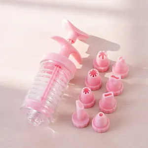 Plastic cookie press gun and 8 piping nozzles set for baking, cream piping tool detail shot.