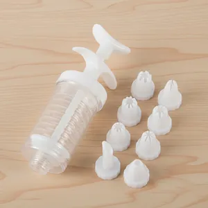 Plastic cookie press gun set with 8 interchangeable piping nozzles for baking pastries.