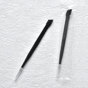 Black precision stainless steel tweezers for nail art stickers and gems detail view