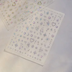 Detailed view of glitter nail stickers with star and heart patterns on transparent film.