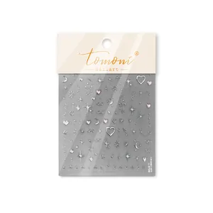 Detailed macro shot of Tomoni sparkle star and heart pattern adhesive nail art stickers