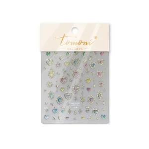 Detailed view of Tomoni glitter nail art stickers with heart and star designs in clear pack