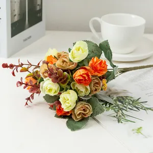 Close-up of artificial rose bouquet with green leaves for home decor and wedding arrangement.