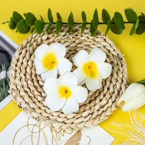Macro view of artificial plumeria foam flowers for Hawaiian hair accessories
