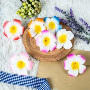 Detailed view of colorful artificial frangipani foam flowers for Hawaii hair accessories