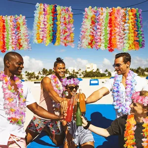 Vibrant colorful Hawaiian flower leis and headbands worn by happy people at a sunny beach party