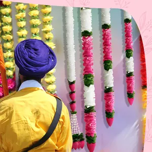 Detail view of artificial jasmine and pink lotus bud garlands for Indian Diwali decor