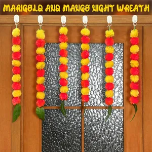 Vibrant yellow and orange marigold garlands with mango leaves for Day of the Dead