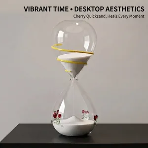 Creative cherry glass sand timer with white sand for modern home office desk decor.