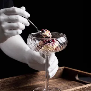 Elegant vintage ribbed tall glass cocktail cup perfect for serving desserts and cold drinks.