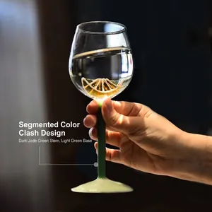 Creative glass wine goblet featuring internal lemon design and contrast green stem