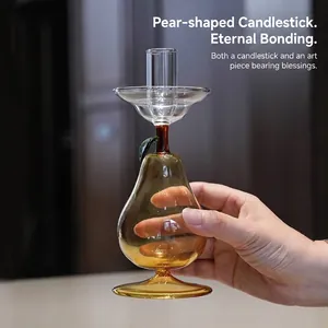 Creative pear shaped glass candle holder with amber finish for home decor and wedding.