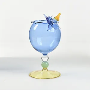 Elegant blue glass wine goblet featuring a handcrafted 3D glass butterfly ornament
