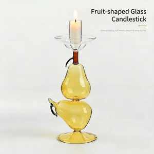 Elegant yellow pear-shaped glass candlestick holder with creative fruit design for home decor