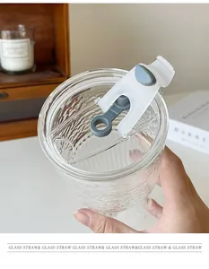 Close-up of a high borosilicate glass cup lid featuring a grey silicone straw plug