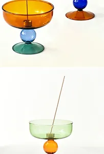 Detail showing minimalist colored glass incense burner with mid-century modern style