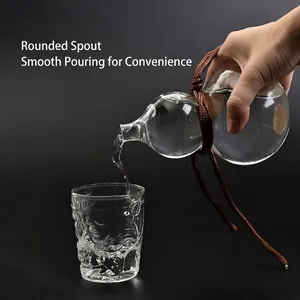 Elegant gourd-shaped glass liquor bottle with textured glass cup for spirits and wine.