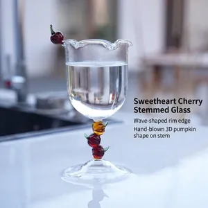 Elegant hand-blown wine glass with unique wavy rim and colorful stacked pumpkin stem