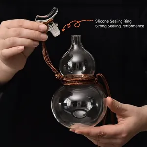 Clear gourd-shaped glass bottle with silicone seal stopper and decorative brown rope