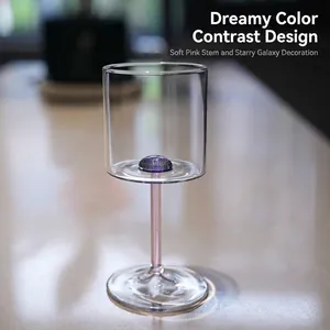 Elegant wine glass featuring a starry galaxy base decoration and a delicate pink glass stem.